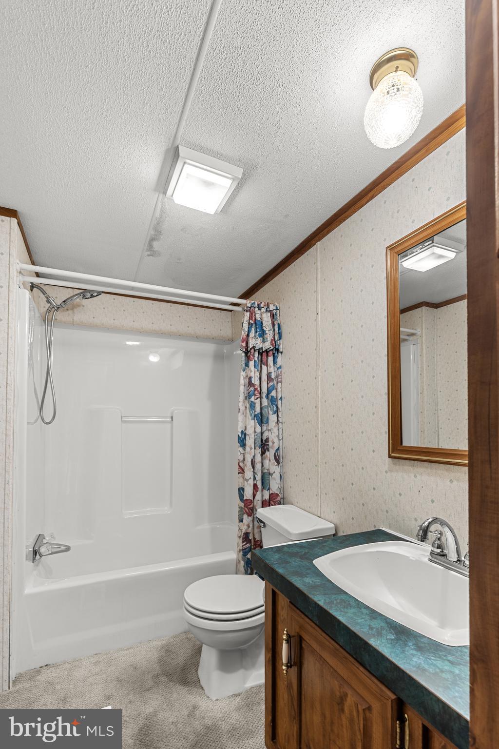 111 Pheasant Ridge Circle Lancaster, PA 17603 - Photo 25 of 29 a bathroom with a granite countertop sink a toilet a mirror and shower