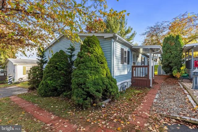 a view of a pathway with a house in the background