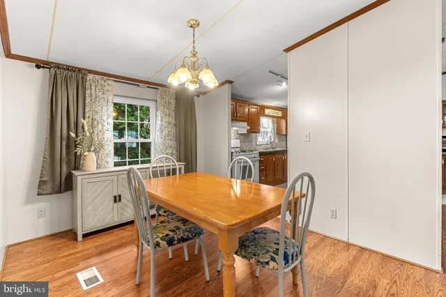 a view of a dining room with furniture and window