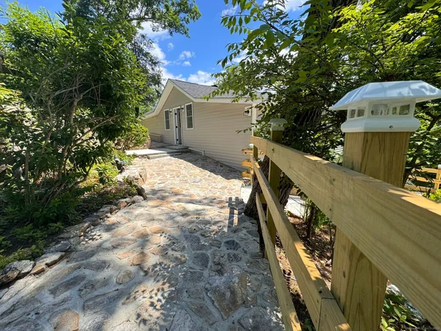 a view of a house with a yard