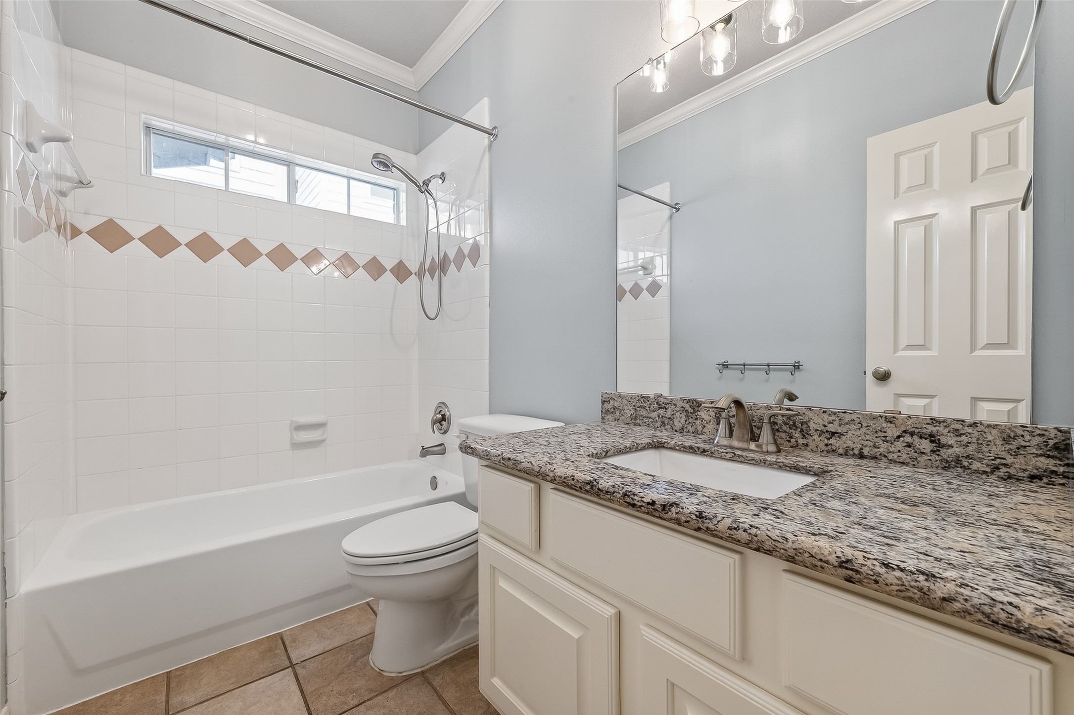 5835 Val Verde Street Houston, TX 77057 - Photo 14 of 21 a bathroom with a granite countertop sink a toilet a large mirror and shower