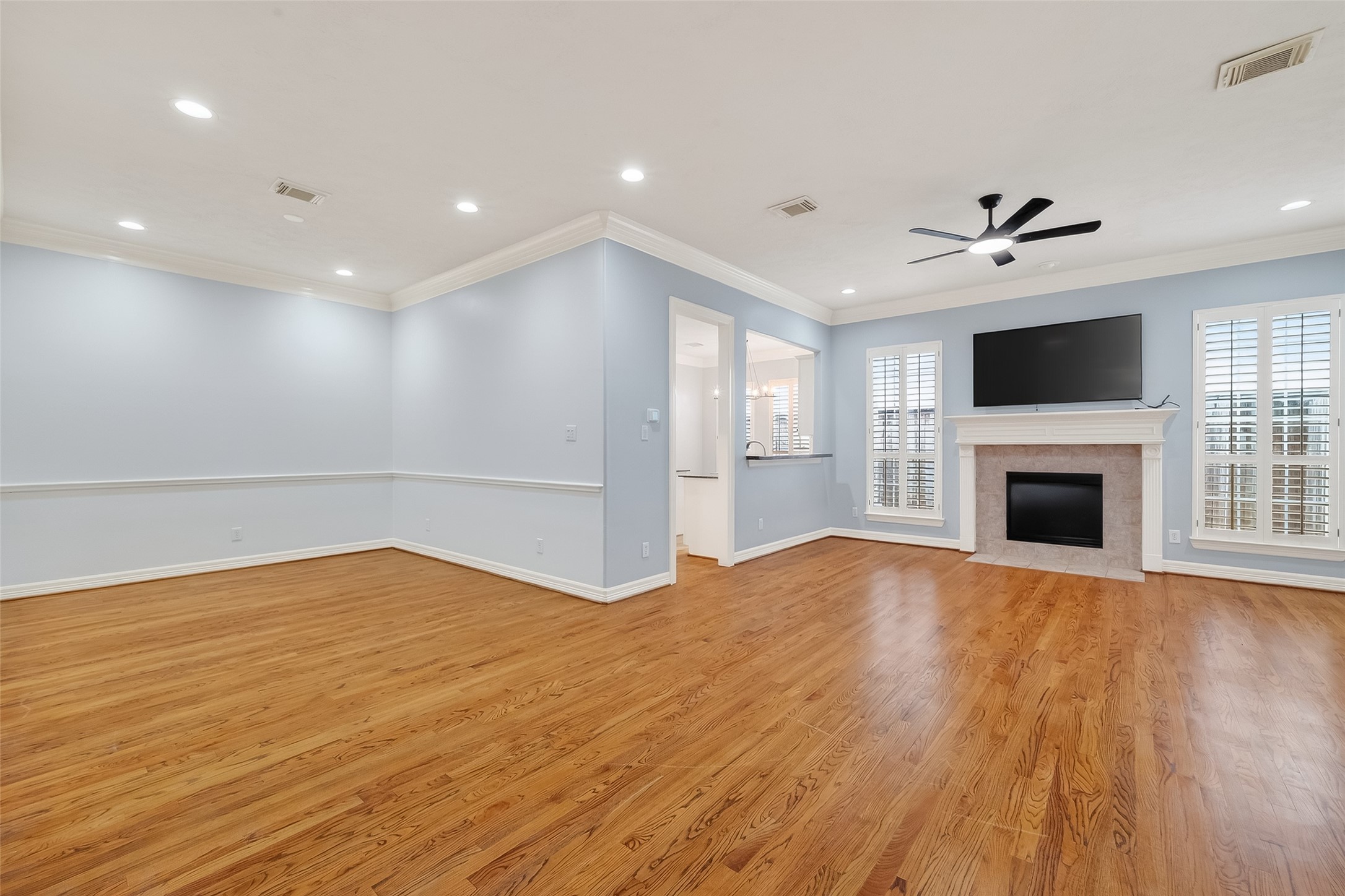 5835 Val Verde Street Houston, TX 77057 - Photo 4 of 21 a view of empty room with wooden floor and fireplace