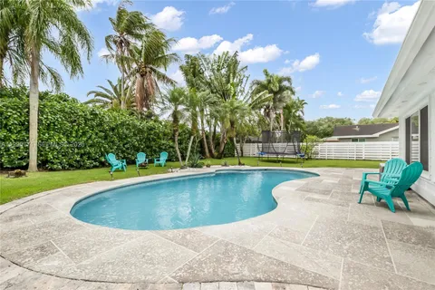 a view of outdoor space yard swimming pool and green space