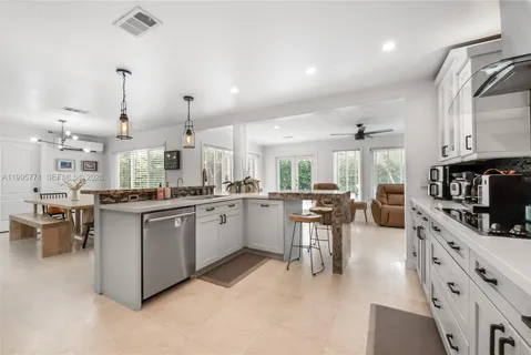 a kitchen with lots of counter top space and appliances
