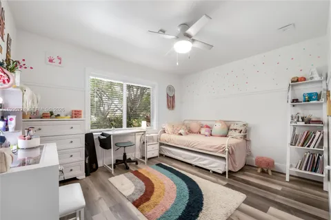 a room with furniture and a large window