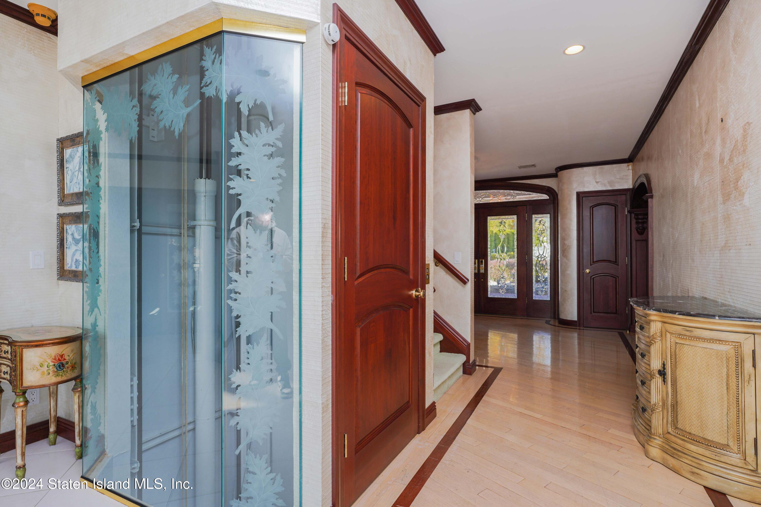 12 Romer Road Staten Island, NY 10304 - Photo 12 of 63 a view of a hallway with wooden floor and staircase