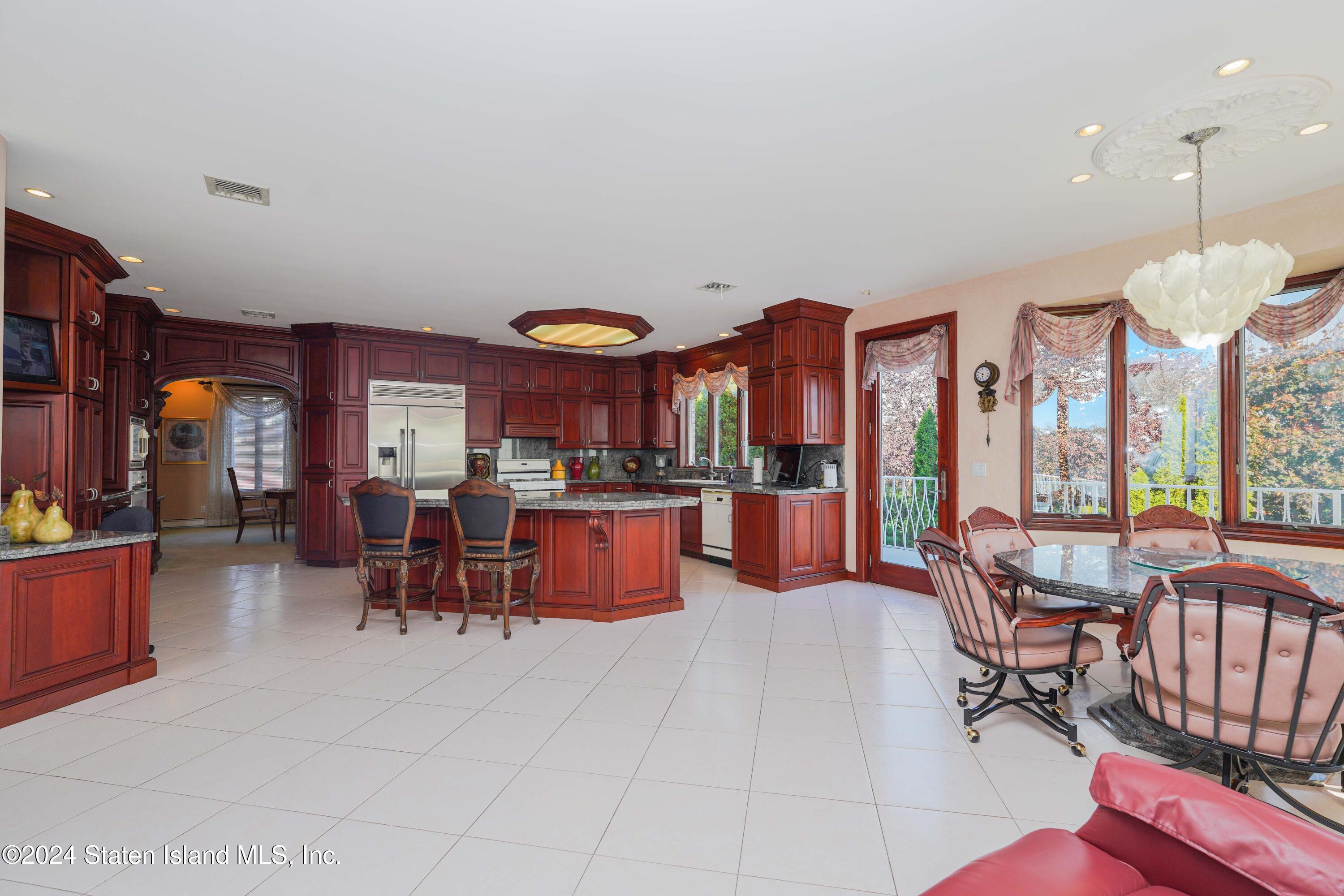 12 Romer Road Staten Island, NY 10304 - Photo 14 of 63 a large living room with patio furniture and a large window