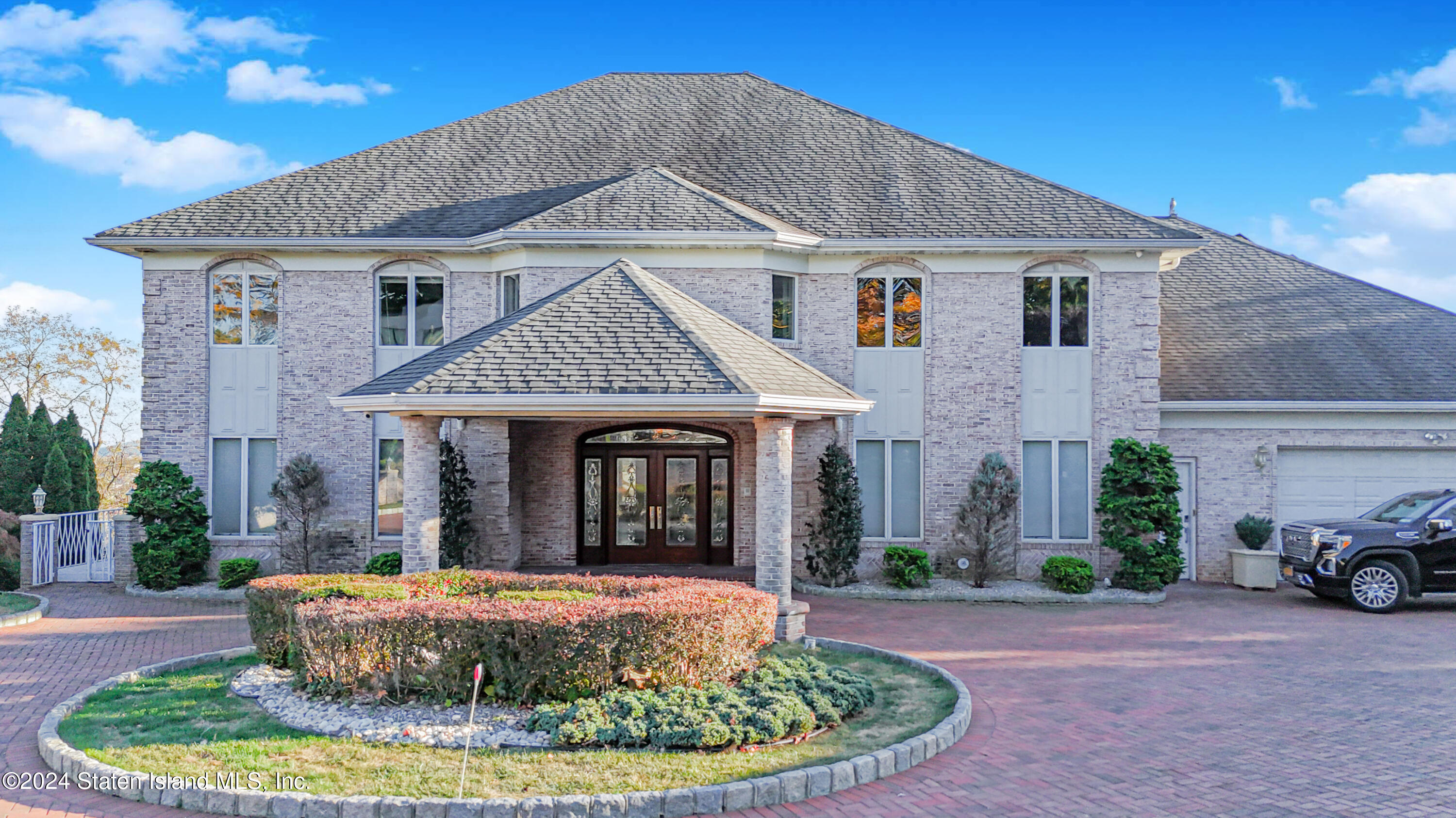 12 Romer Road Staten Island, NY 10304 - Photo 2 of 63 a front view of a house with a yard
