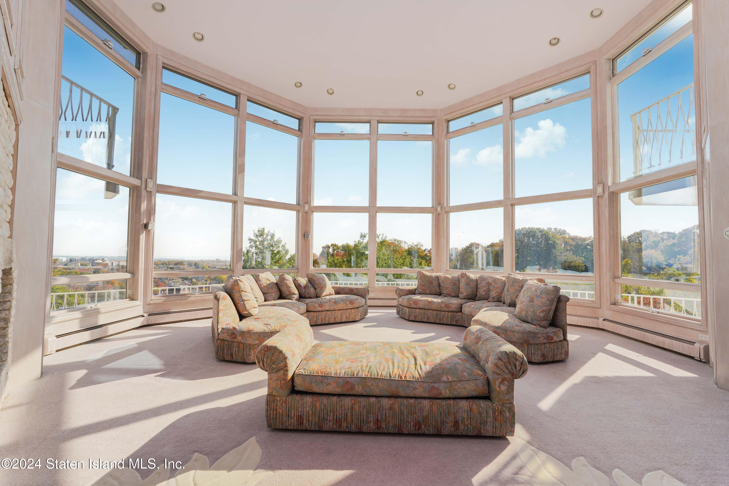 12 Romer Road Staten Island, NY 10304 - Photo 23 of 63 a living room with furniture and large windows