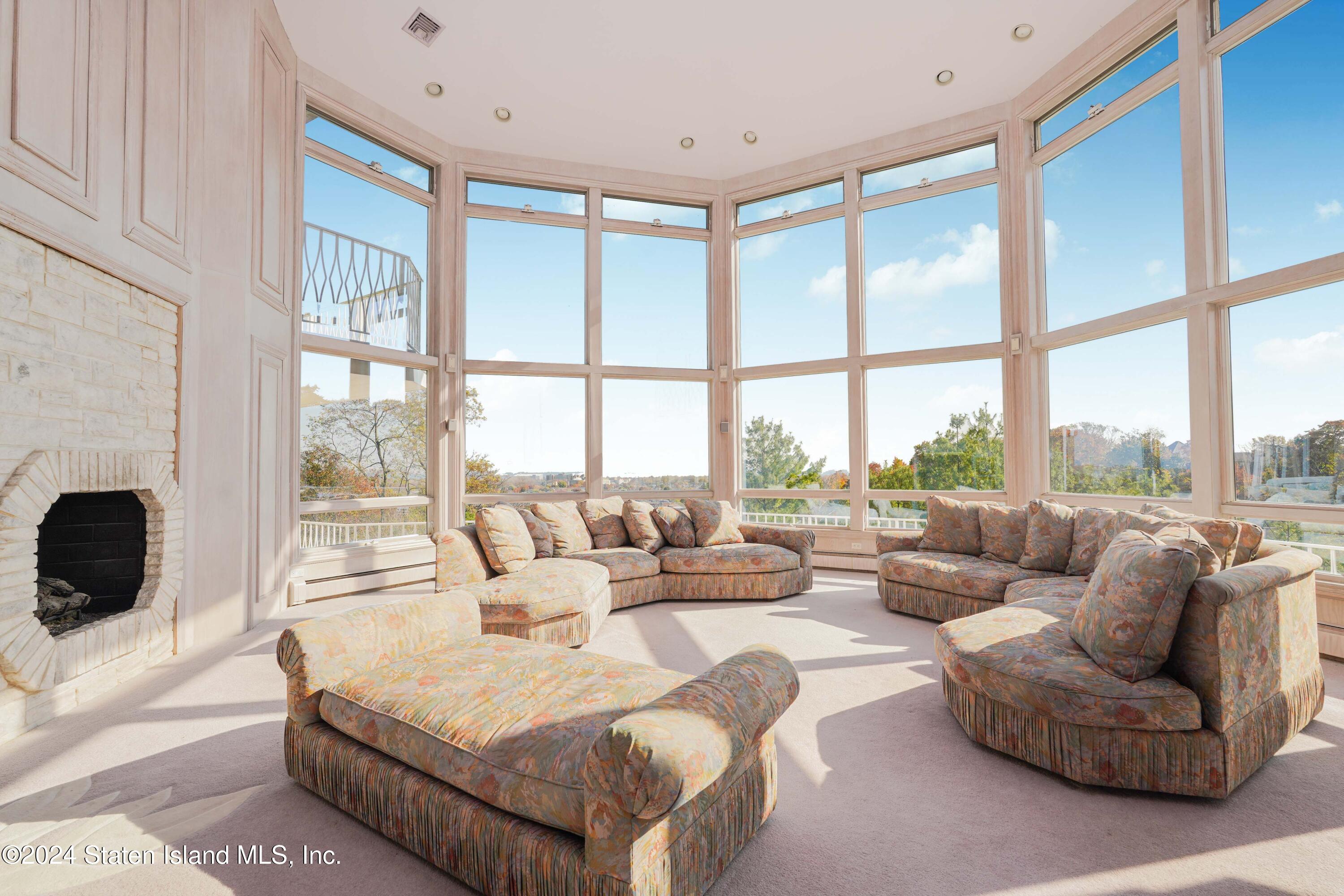 12 Romer Road Staten Island, NY 10304 - Photo 24 of 63 a living room with furniture and a large window