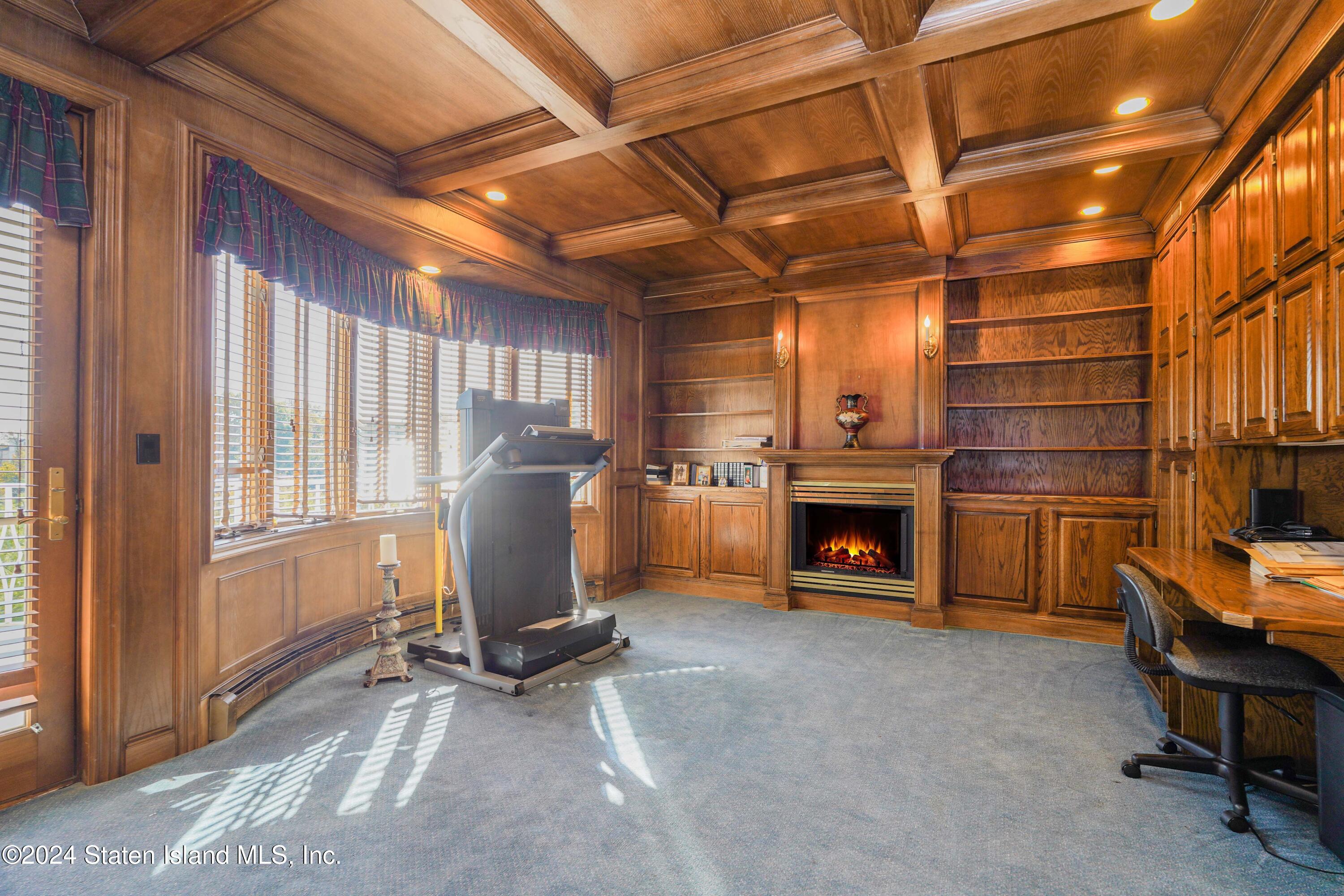 12 Romer Road Staten Island, NY 10304 - Photo 29 of 63 a view of a livingroom with a fireplace and workspace