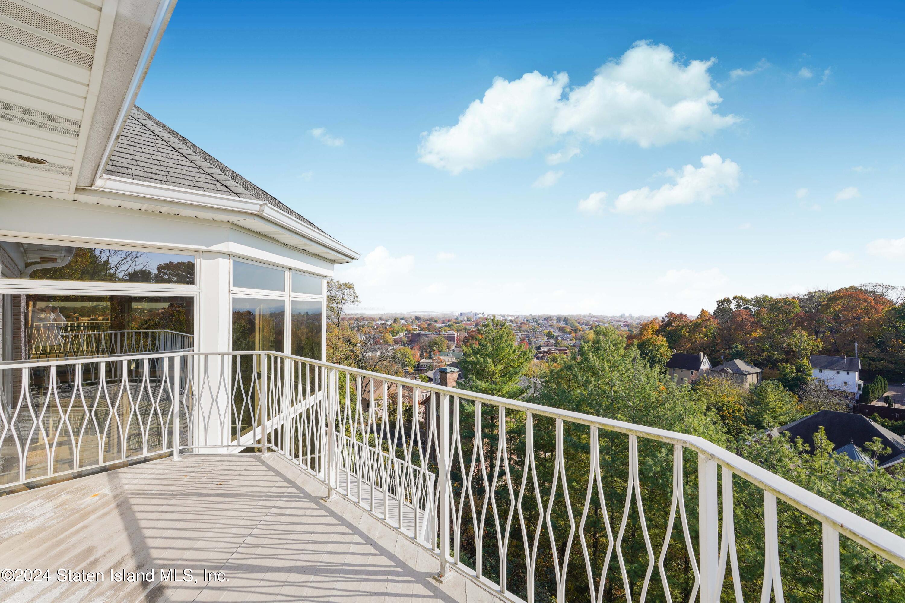 12 Romer Road Staten Island, NY 10304 - Photo 38 of 63 a balcony with wooden floor and city view