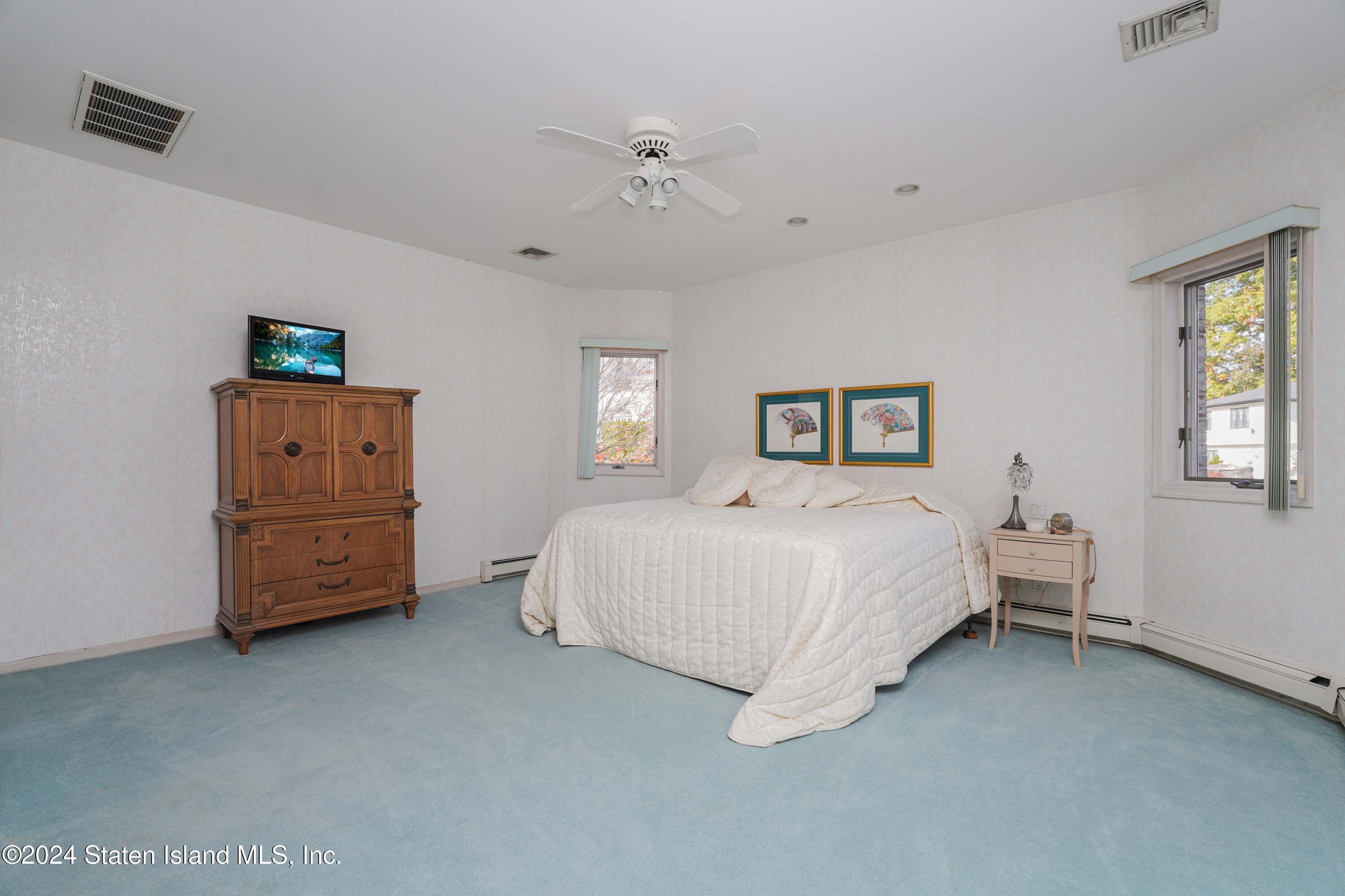 12 Romer Road Staten Island, NY 10304 - Photo 41 of 63 a bed room with a bed and a night stand