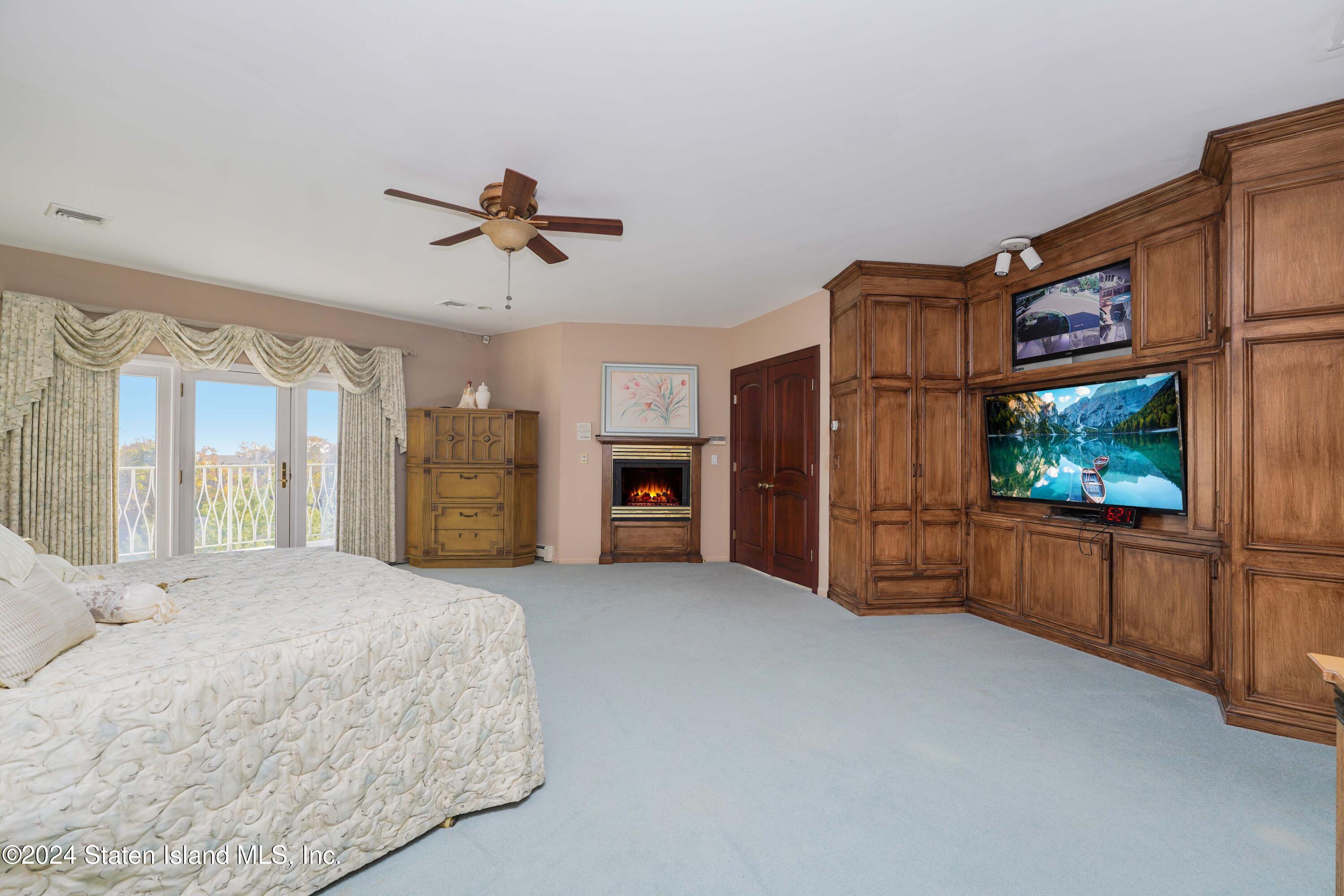 12 Romer Road Staten Island, NY 10304 - Photo 42 of 63 a living room with furniture and a flat screen tv