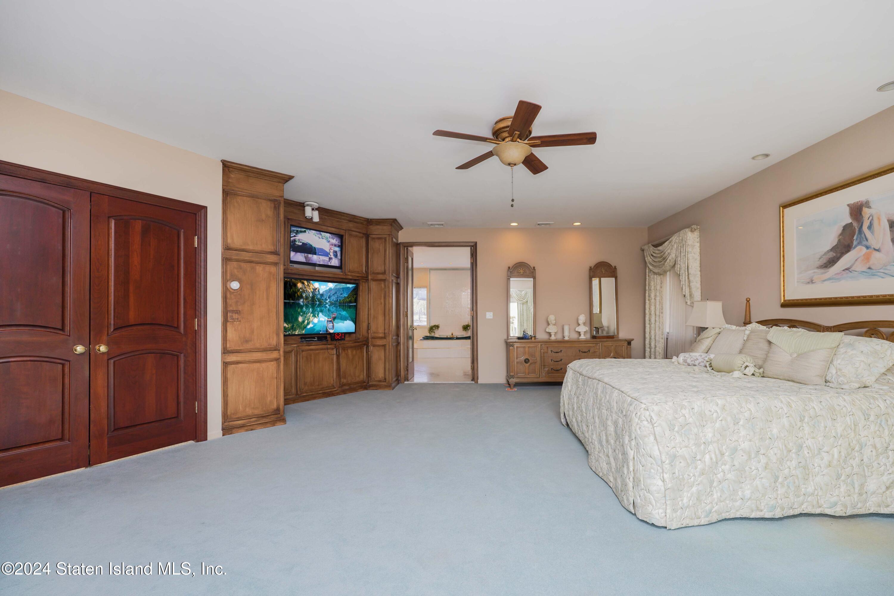 12 Romer Road Staten Island, NY 10304 - Photo 45 of 63 a living room with furniture and a flat screen tv