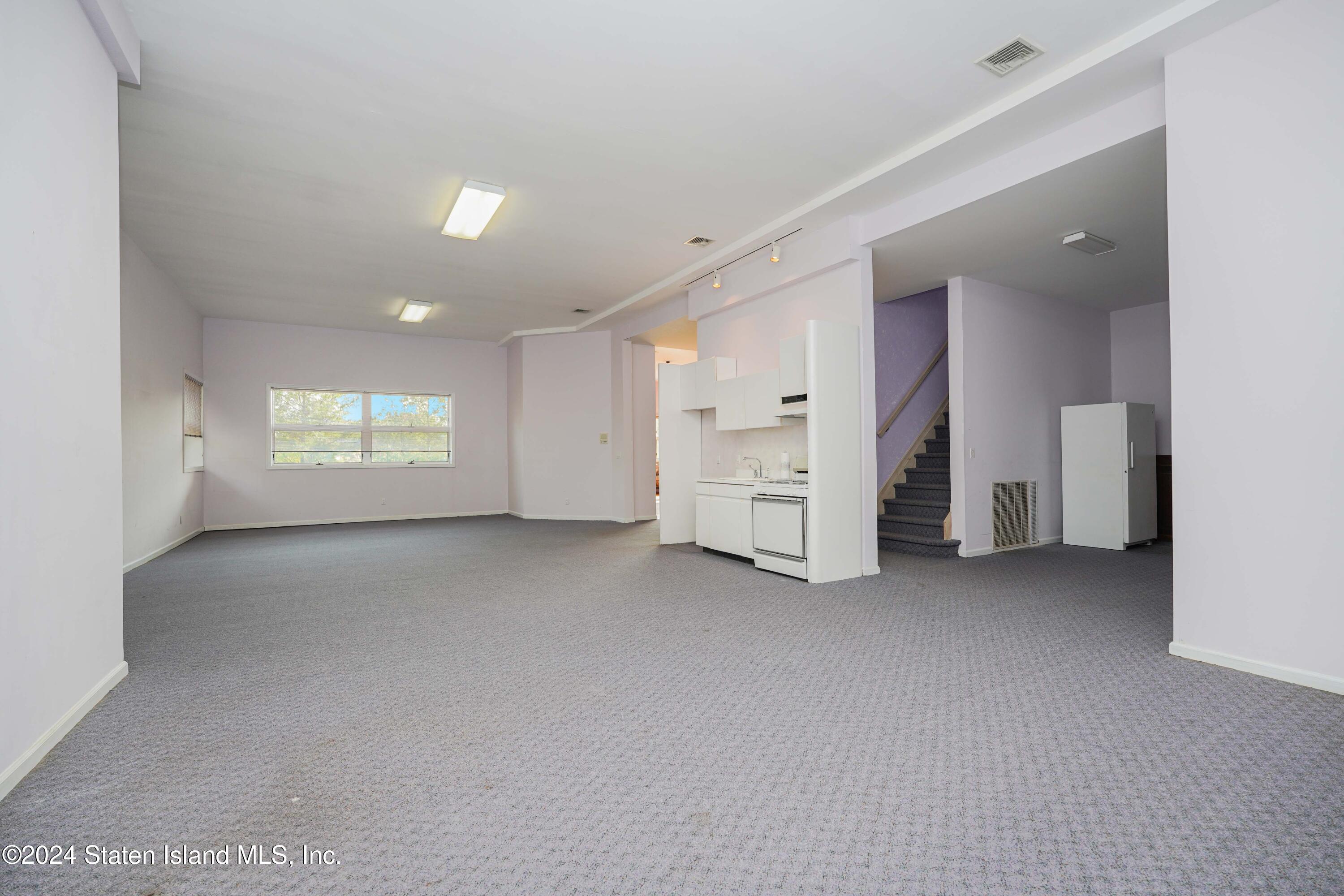 12 Romer Road Staten Island, NY 10304 - Photo 50 of 63 an empty room with a window and a dresser
