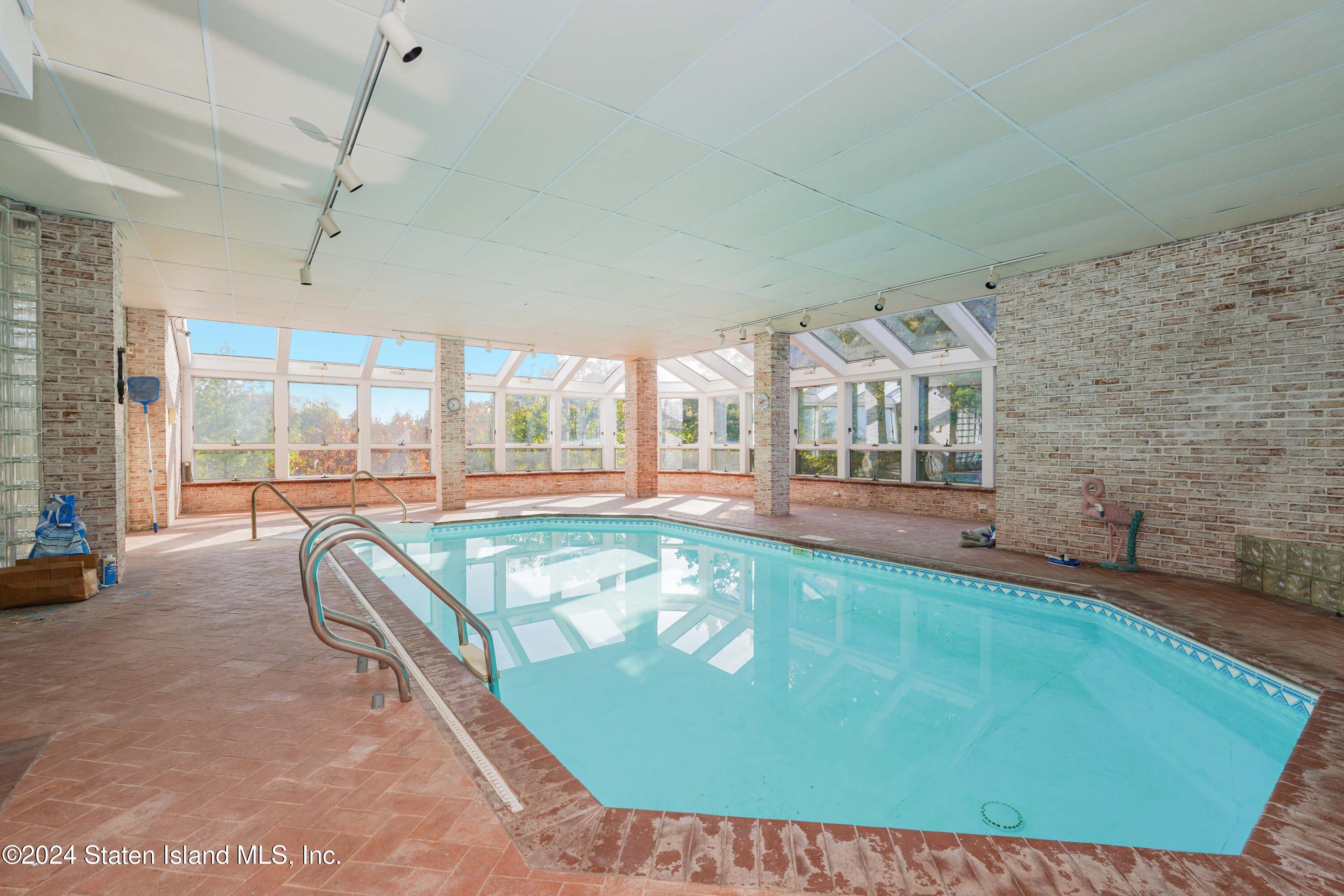 12 Romer Road Staten Island, NY 10304 - Photo 54 of 63 a living room with a bed furniture and a large window