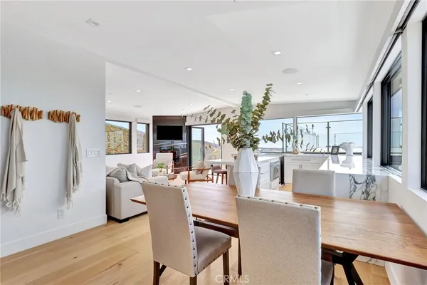 a living room with fireplace furniture and a wooden floor