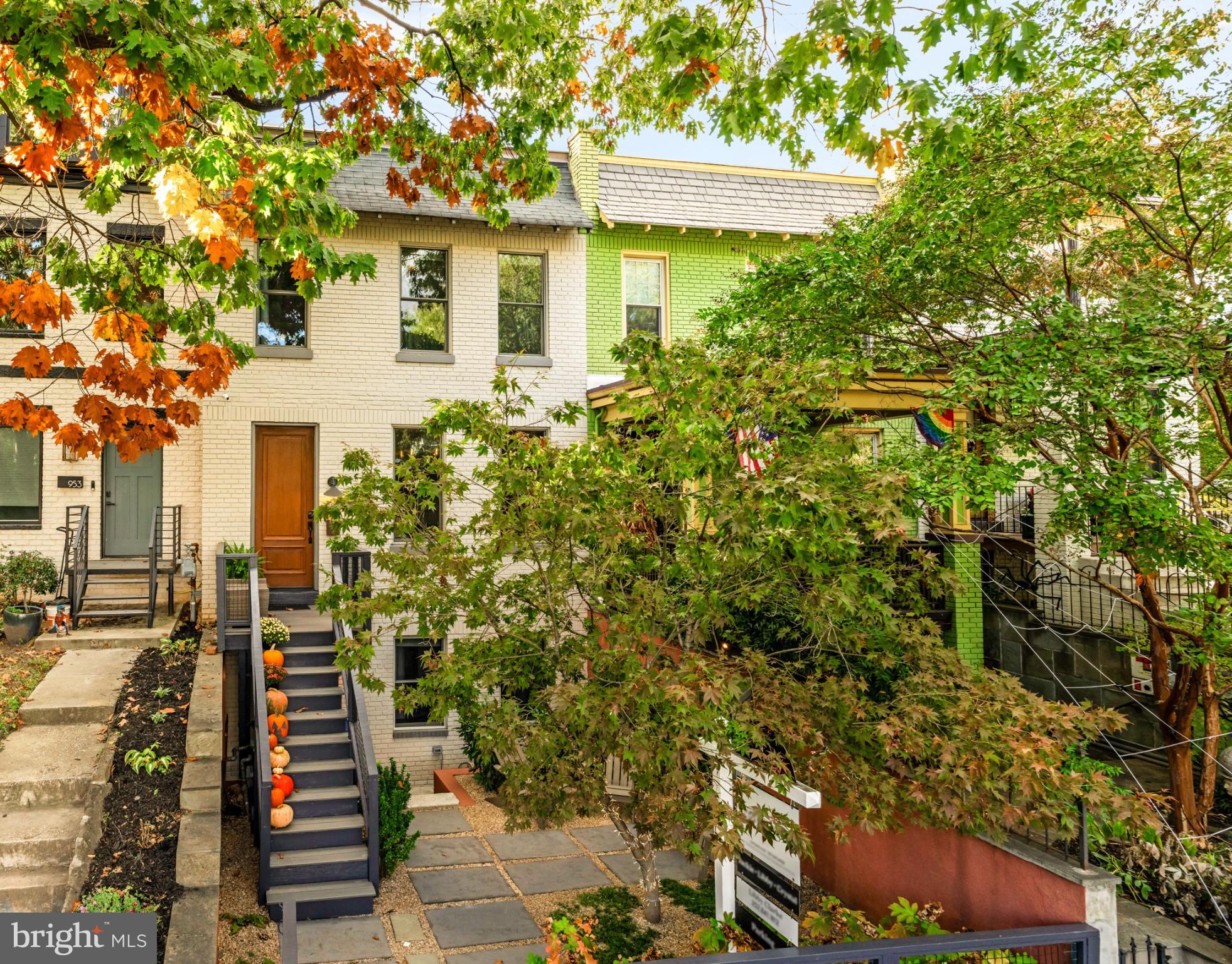 front view of a house with a tree