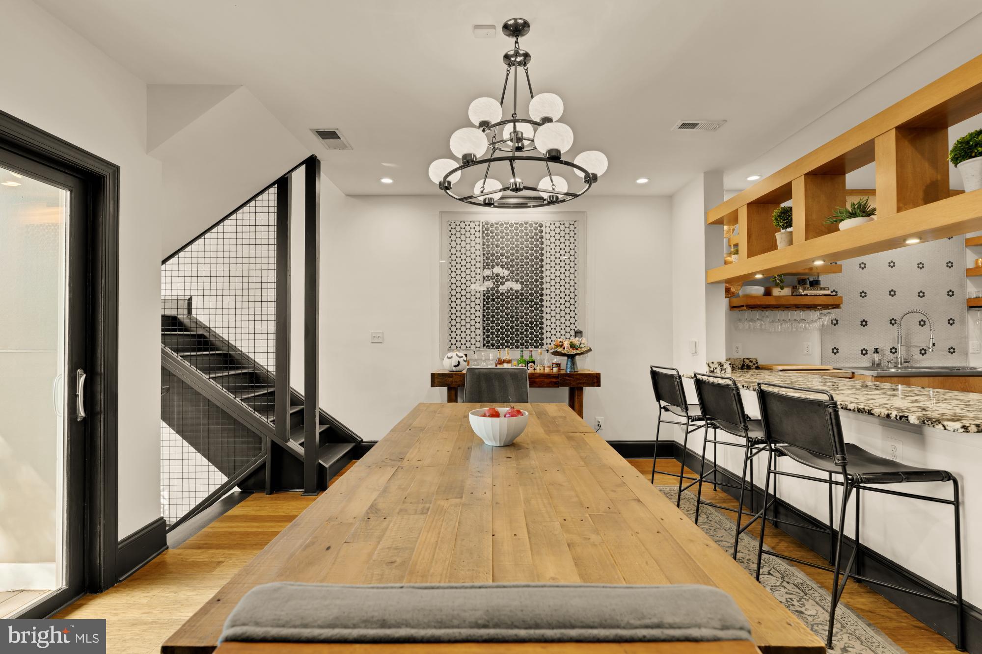 951 14th Street Southeast Washington, DC 20003 - Photo 18 of 50 a bed room with a bed mirror and a chandelier