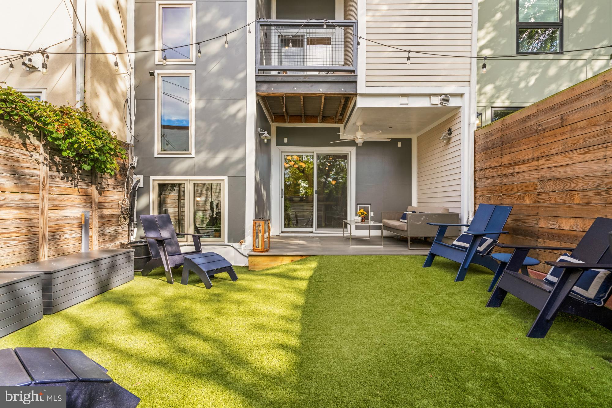 951 14th Street Southeast Washington, DC 20003 - Photo 21 of 50 a view of a patio with table and chairs and potted plants