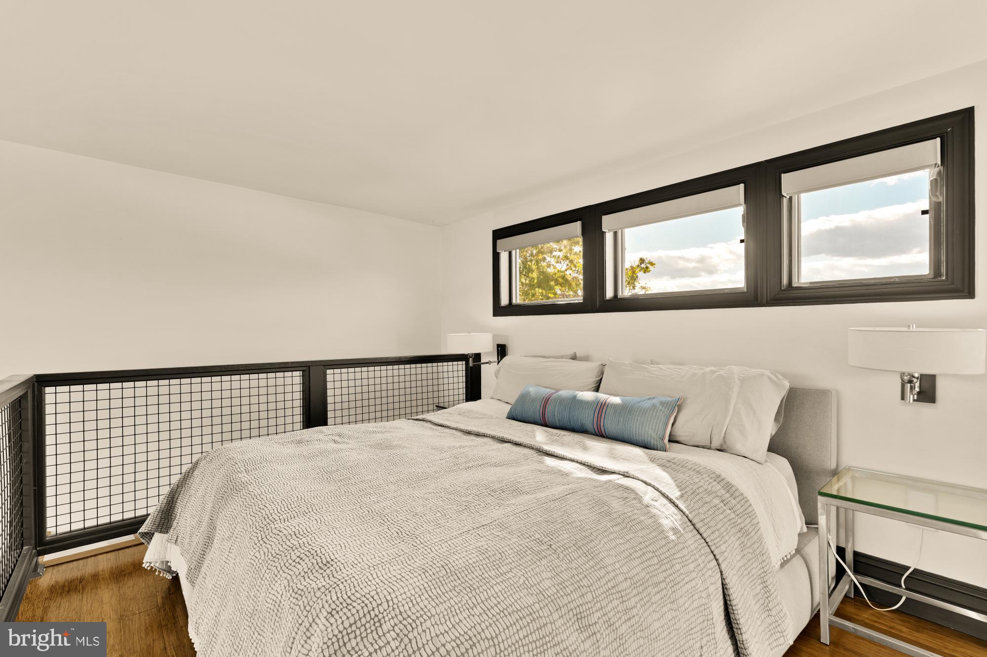 951 14th Street Southeast Washington, DC 20003 - Photo 29 of 50 a bedroom with a bed and painting on the wall