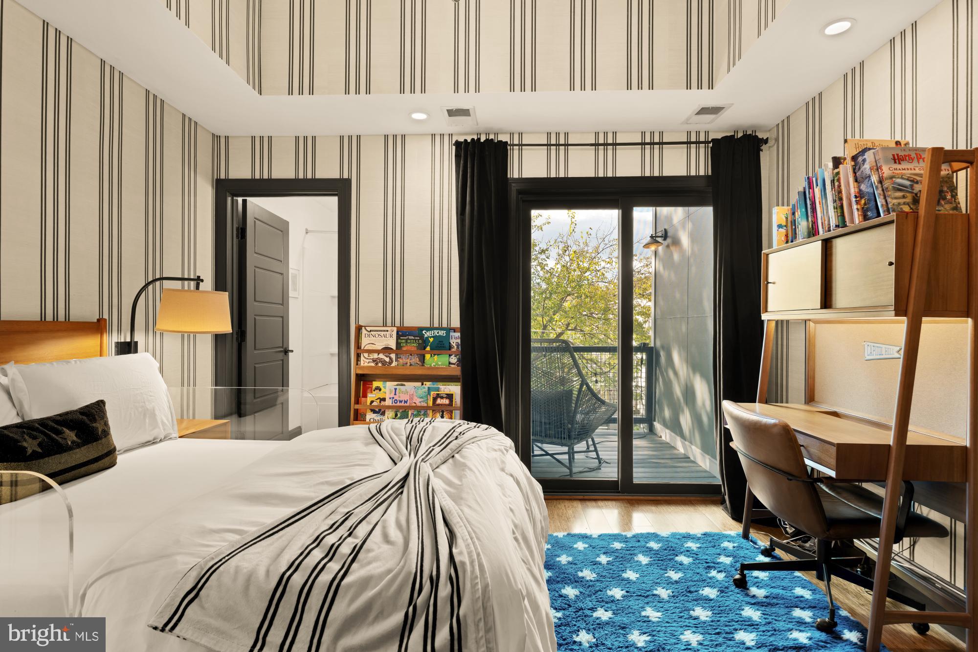 951 14th Street Southeast Washington, DC 20003 - Photo 35 of 50 a bedroom with a bed and large window