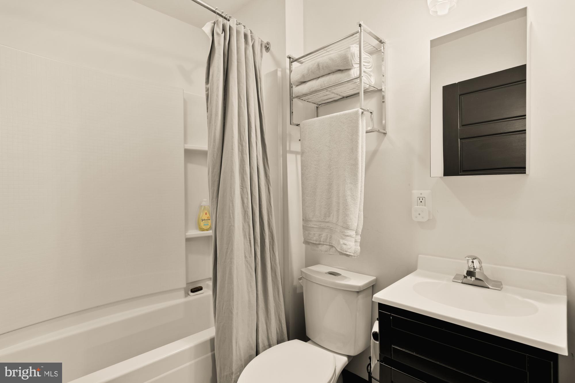 951 14th Street Southeast Washington, DC 20003 - Photo 36 of 50 a bathroom with a sink toilet and shower