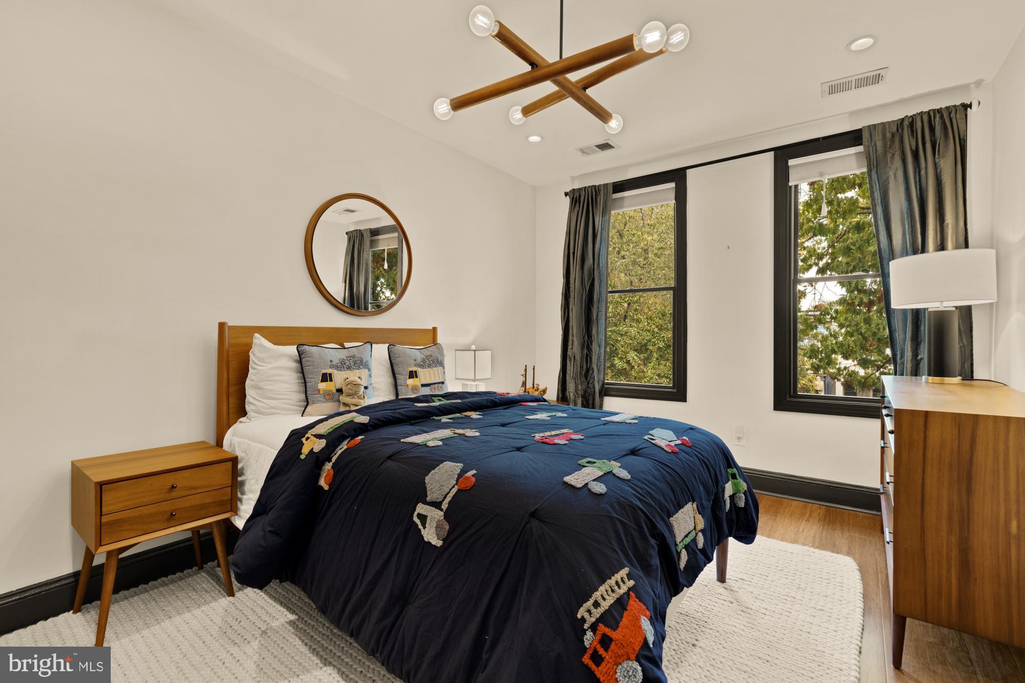 951 14th Street Southeast Washington, DC 20003 - Photo 37 of 50 a bedroom with a bed a dresser and a window