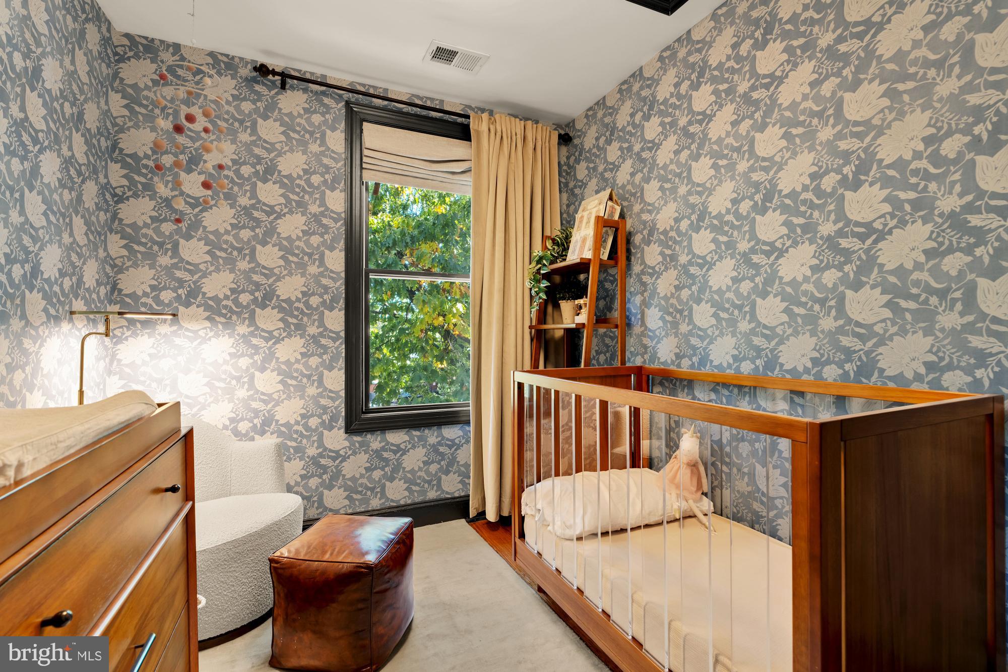 951 14th Street Southeast Washington, DC 20003 - Photo 39 of 50 a living room with furniture and a window