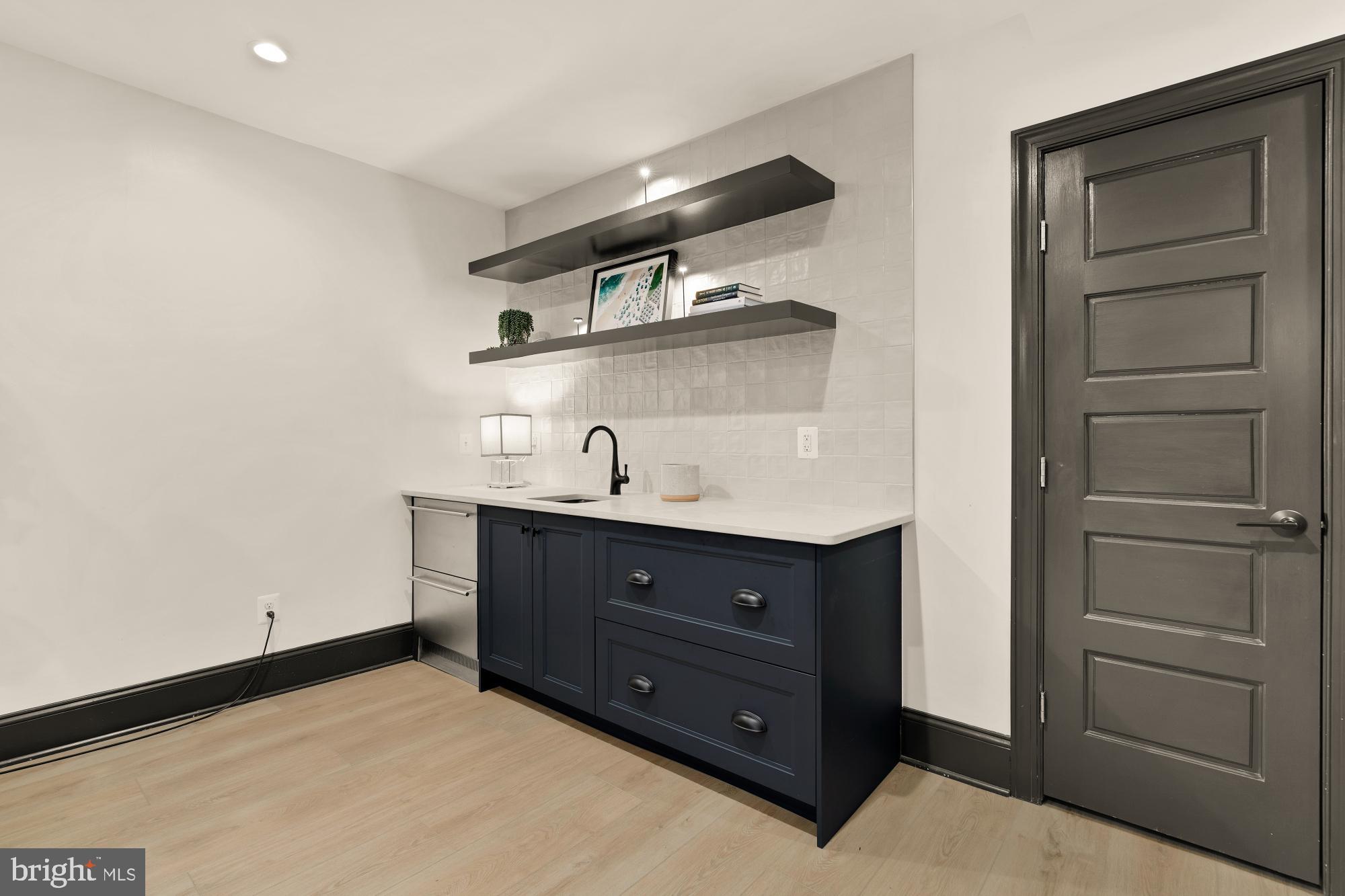 951 14th Street Southeast Washington, DC 20003 - Photo 41 of 50 a room with a dresser and a mirror