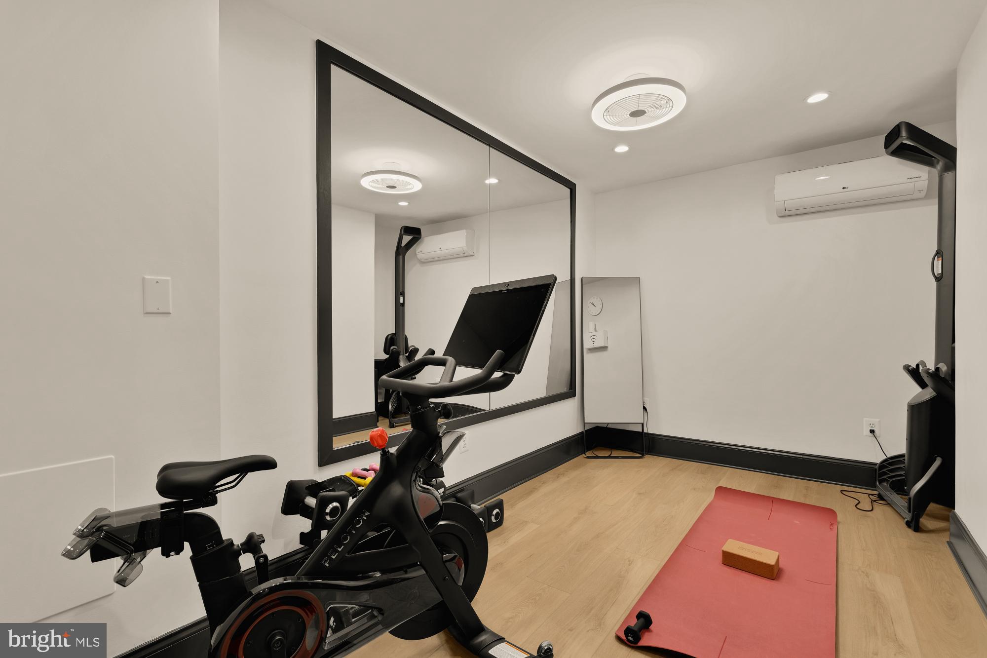 951 14th Street Southeast Washington, DC 20003 - Photo 43 of 50 a room with gym equipment and mirror