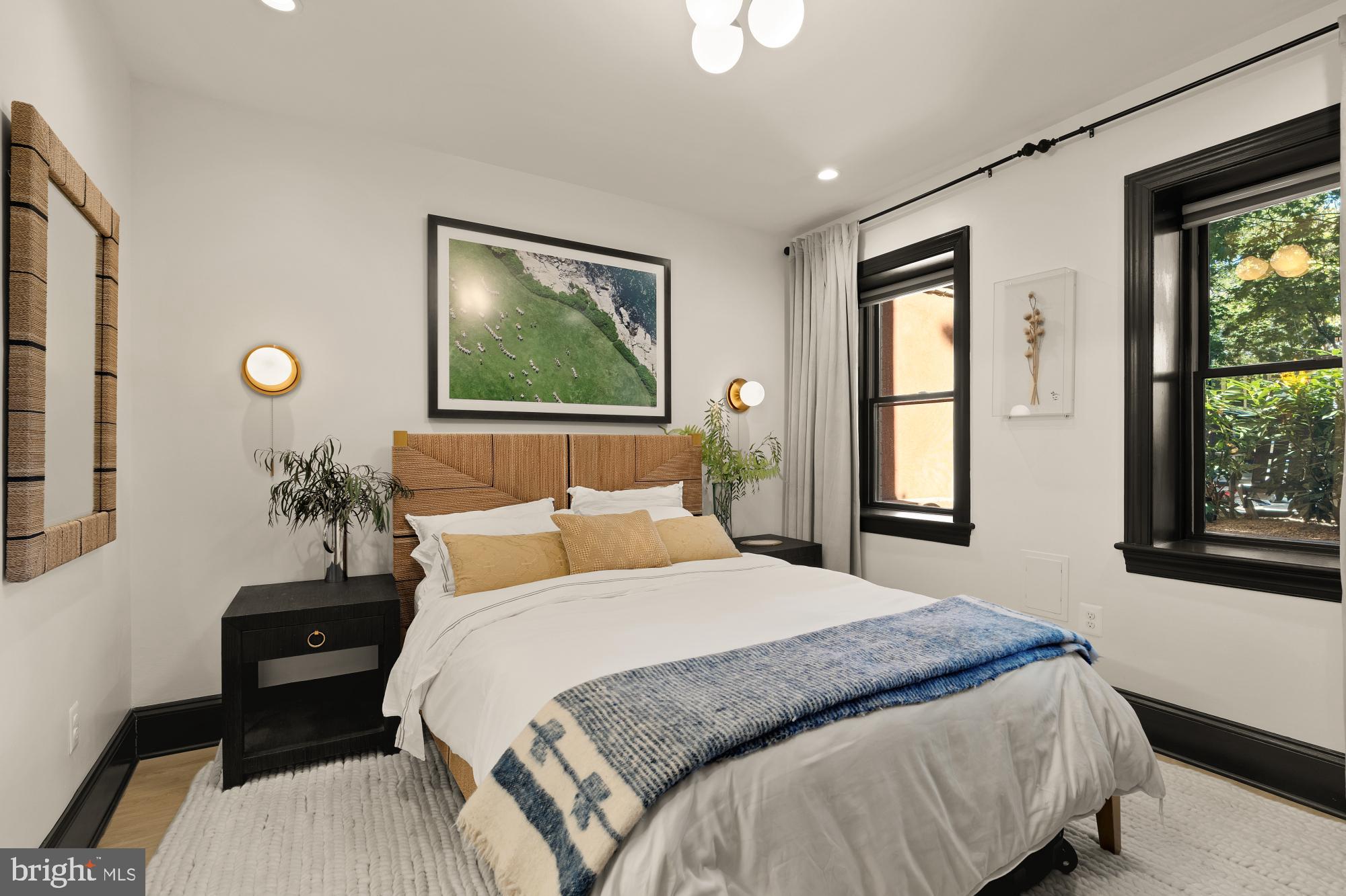 951 14th Street Southeast Washington, DC 20003 - Photo 45 of 50 a bedroom with a bed and a window