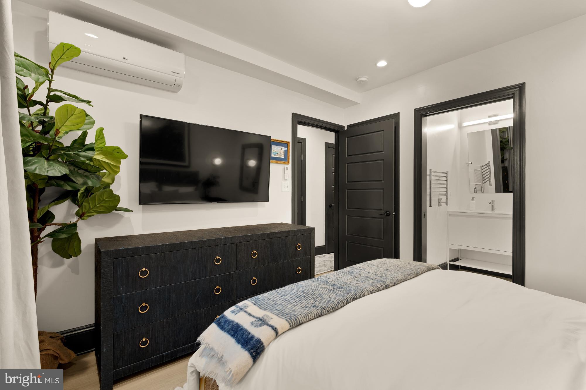 951 14th Street Southeast Washington, DC 20003 - Photo 46 of 50 a bedroom with a bed and a television