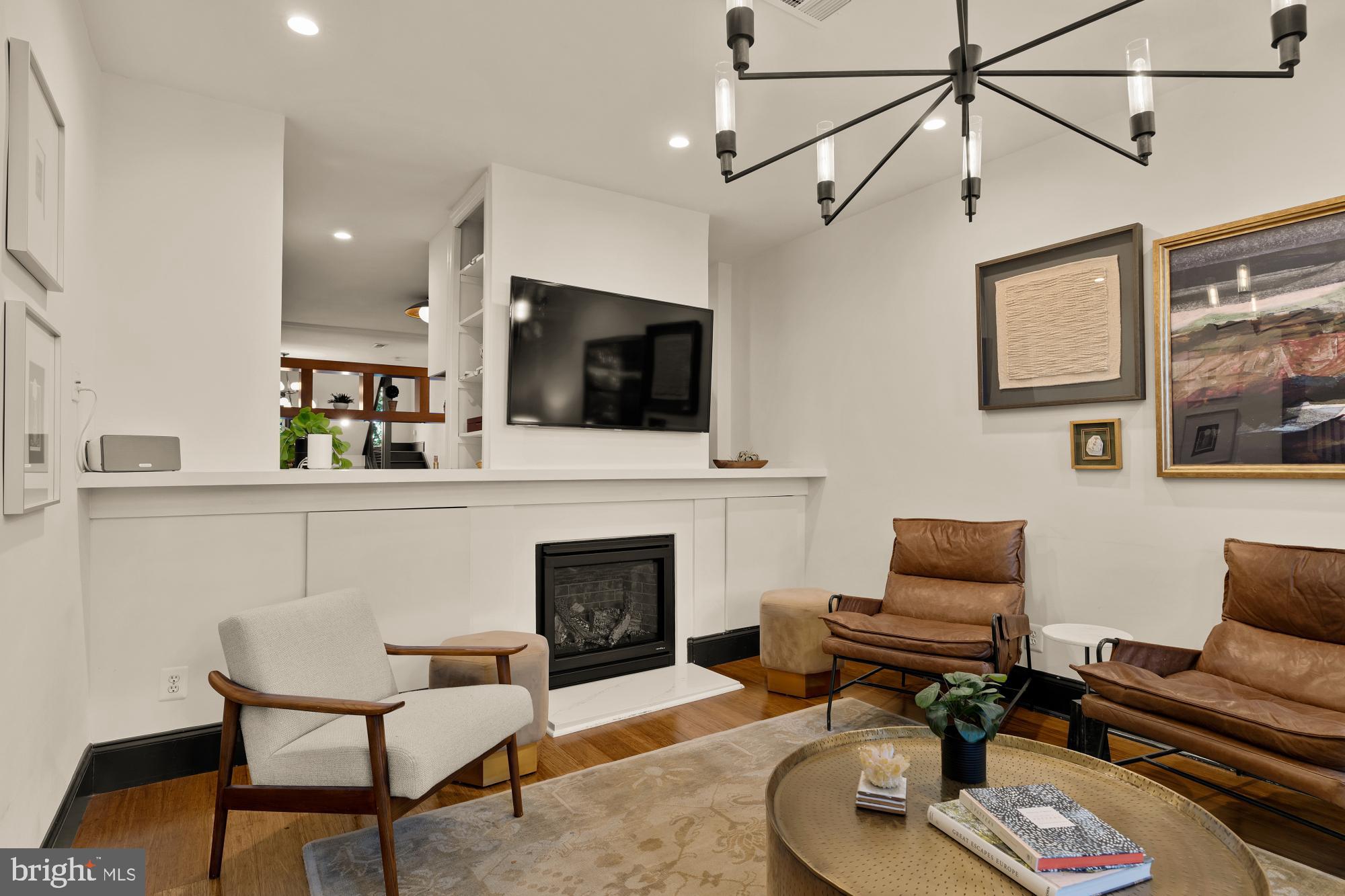 951 14th Street Southeast Washington, DC 20003 - Photo 6 of 50 a living room with furniture and a fireplace