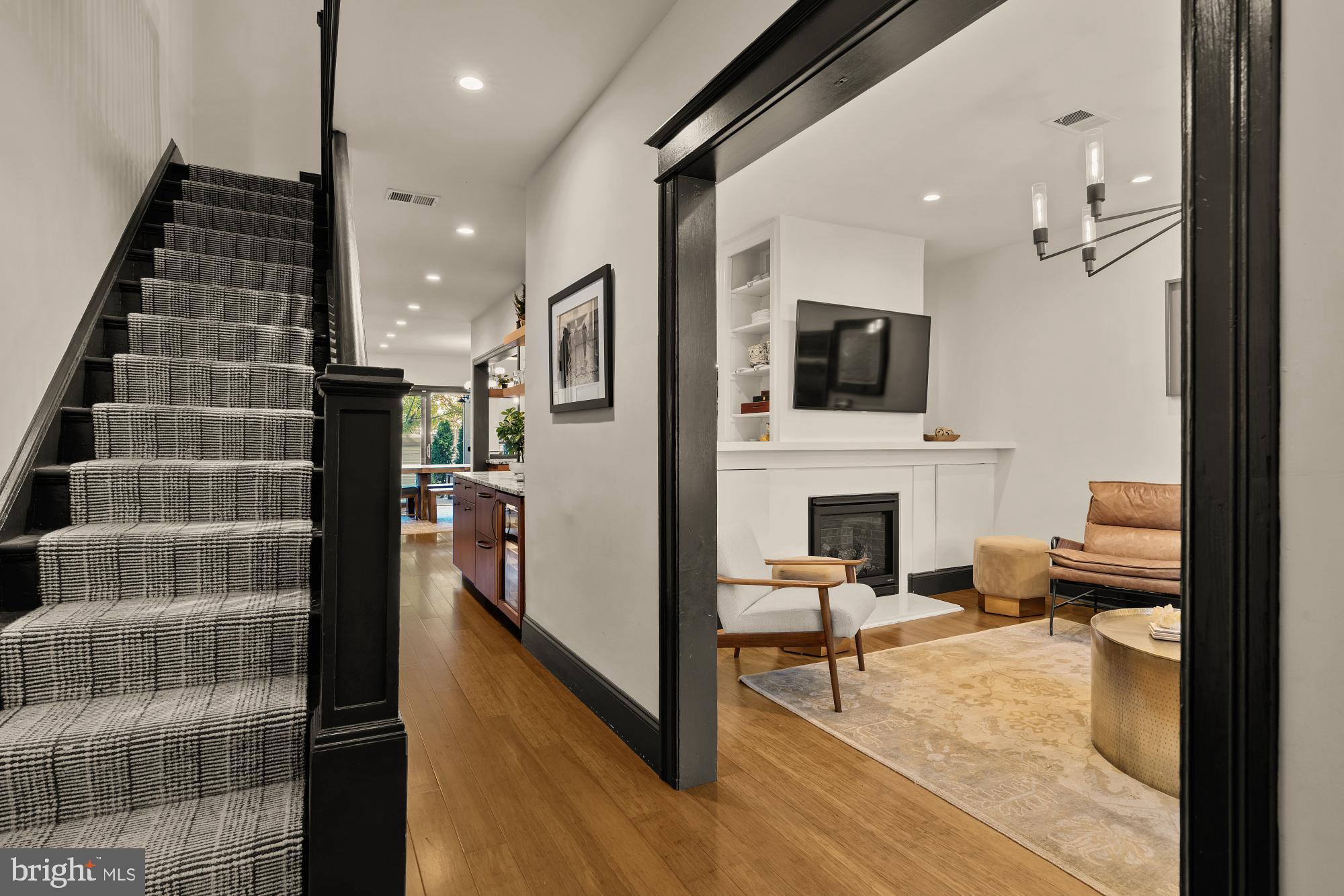 951 14th Street Southeast Washington, DC 20003 - Photo 8 of 50 a living room with furniture and a fireplace