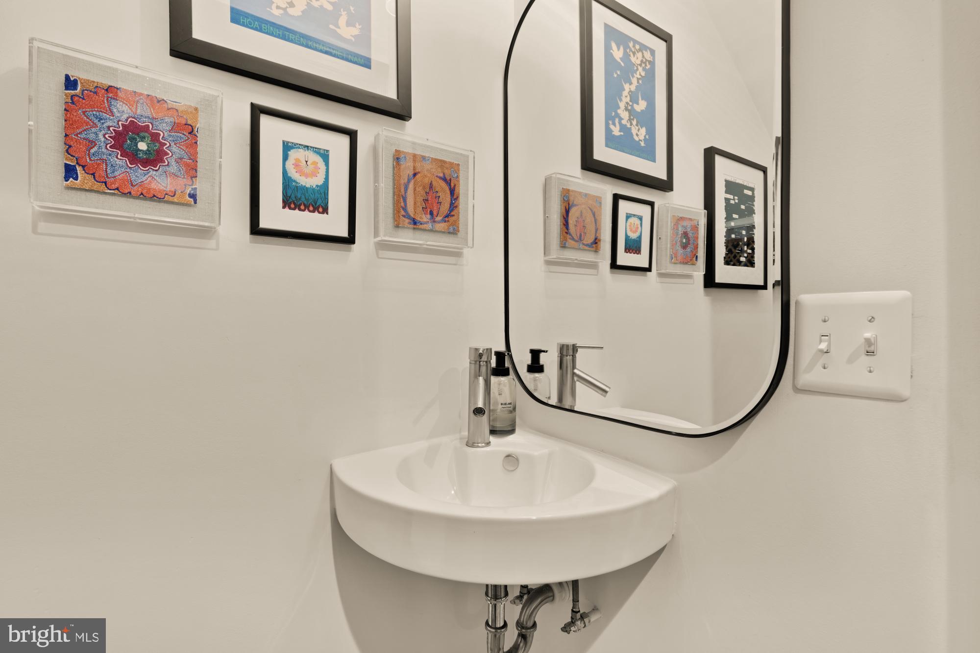 951 14th Street Southeast Washington, DC 20003 - Photo 9 of 50 a bathroom with a sink and a mirror
