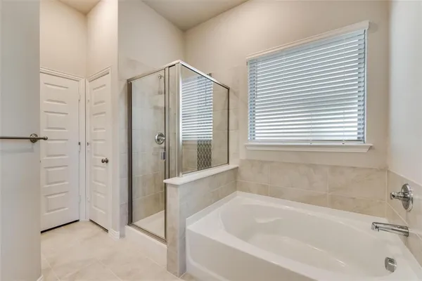 a white bath tub sitting next to a window