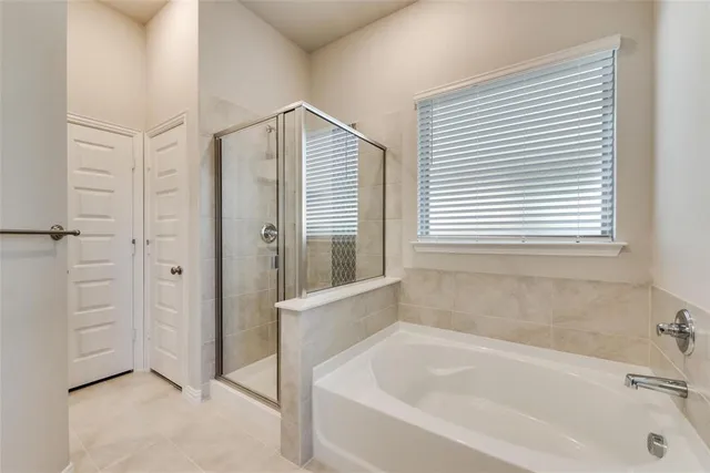 a white bath tub sitting next to a window