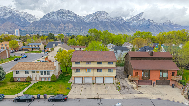 630 1100 West Provo, UT 84601 - Photo 62 of 64 Multi-unit property featuring a brown shingle roof and three garage doors