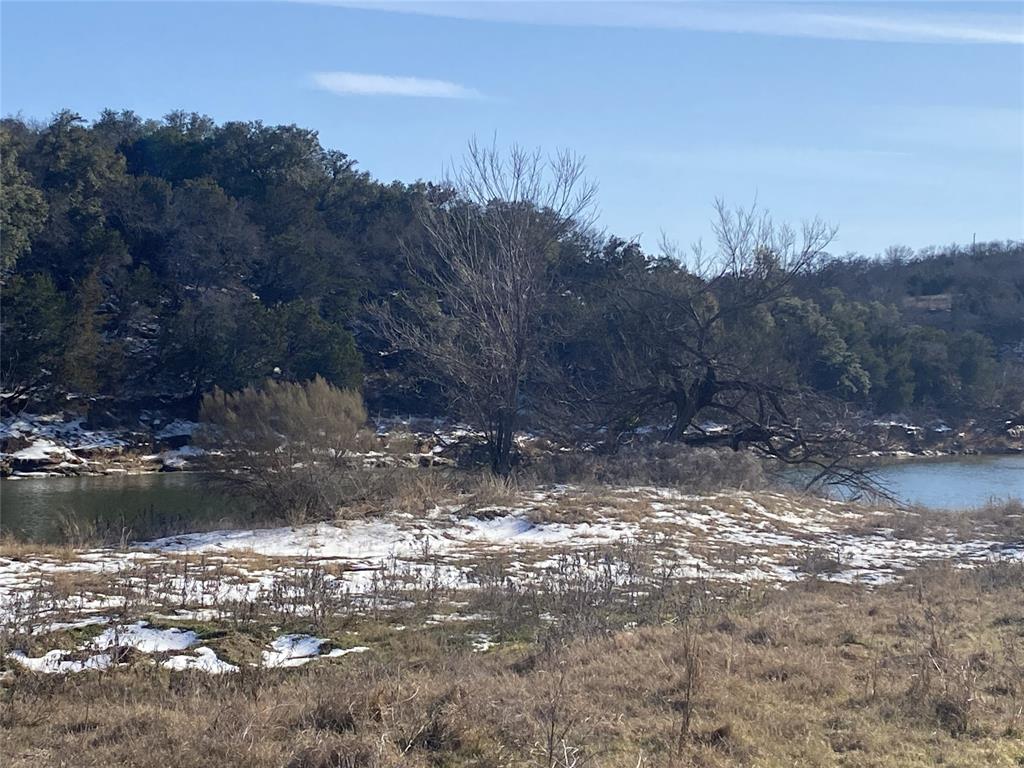 Lot 133 River Shoals Weatherford, TX 76088 - Photo 2 of 20 a view of a lake with a mountain
