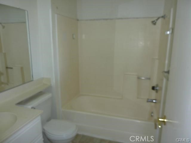840 East Cedar Street Ontario, CA 91761 - Photo 5 of 14 a bathroom with a shower a toilet and a sink