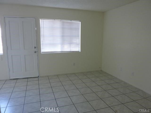 840 East Cedar Street Ontario, CA 91761 - Photo 6 of 14 an empty room with white cabinet and window