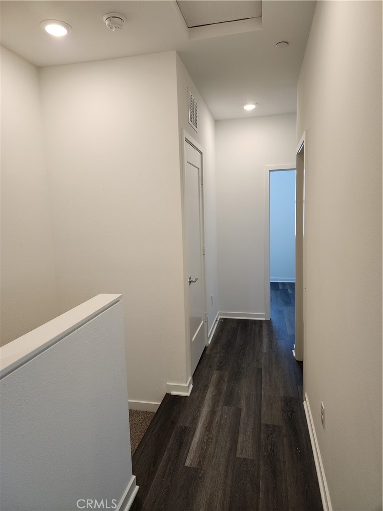 840 East Cedar Street Ontario, CA 91761 - Photo 10 of 14 a view of a hallway with wooden floor