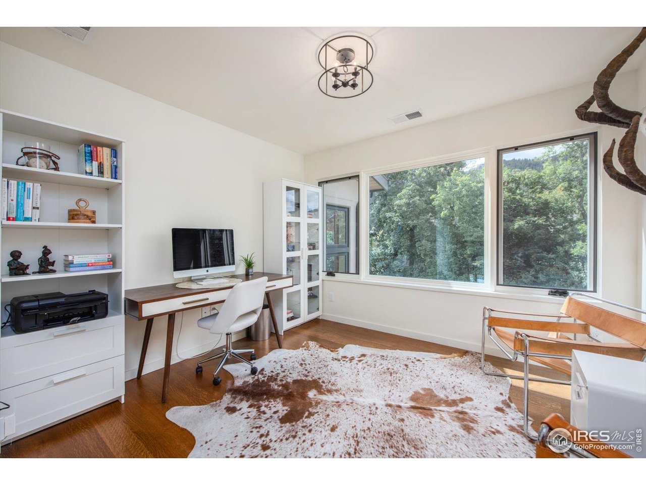 707 8th Street Boulder, CO 80302 - Photo 19 of 37 a living room with furniture and a flat screen tv