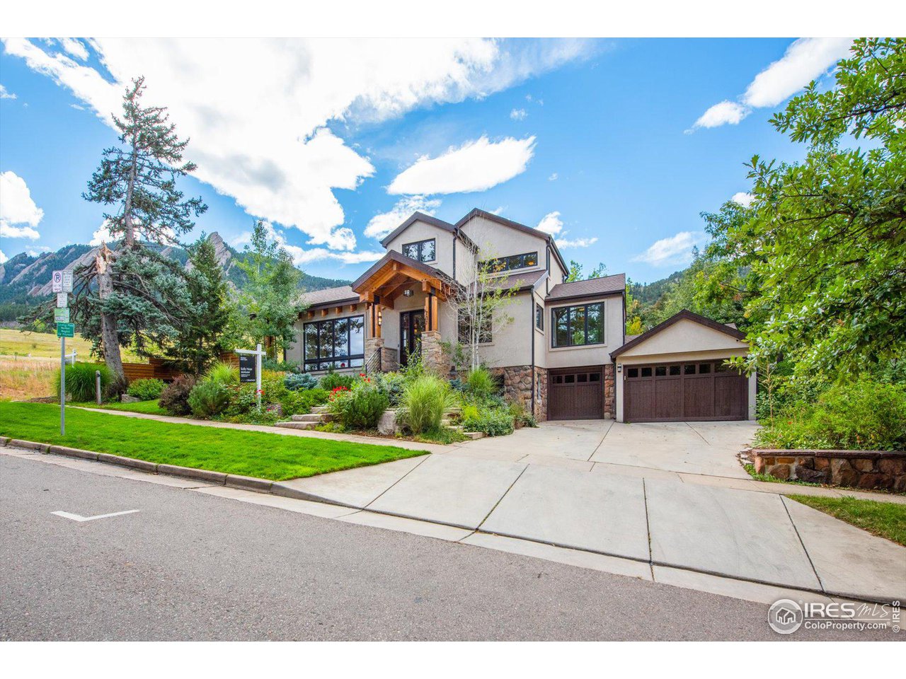 707 8th Street Boulder, CO 80302 - Photo 2 of 37 a front view of a house with a yard and trees