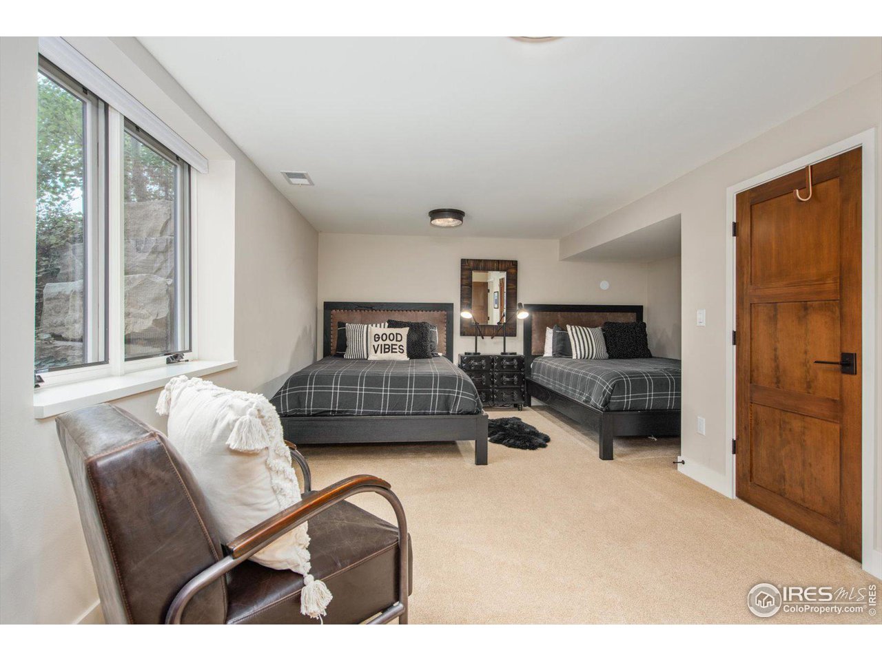 707 8th Street Boulder, CO 80302 - Photo 23 of 37 a bedroom with furniture and a window