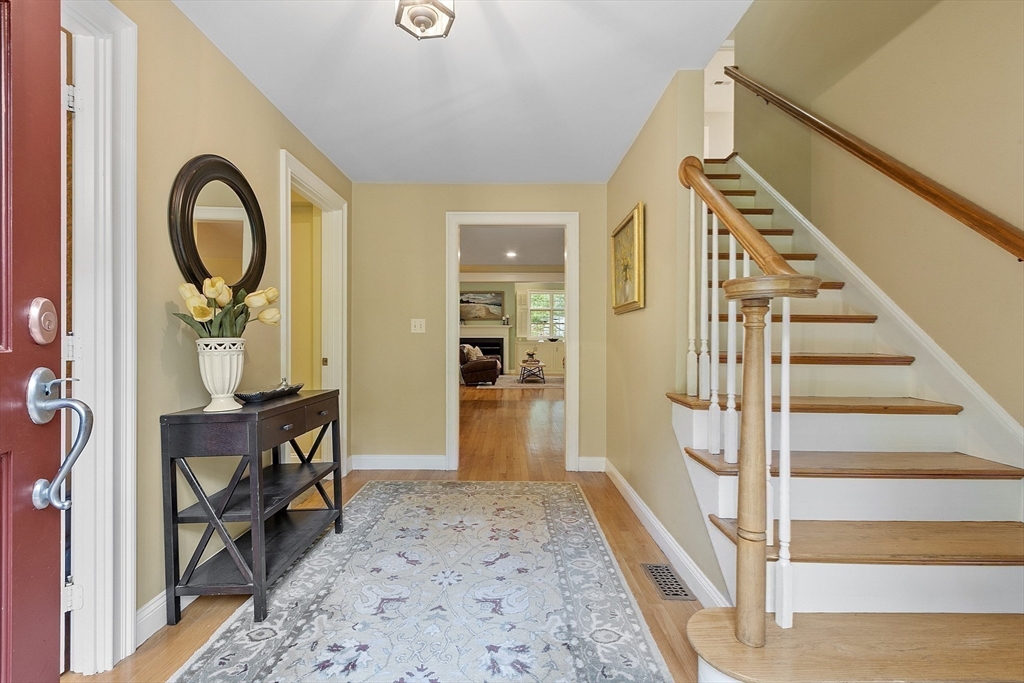 62 Waite Road Boxborough, MA 01719 - Photo 20 of 41 a view of an entryway with wooden floor and a livingroom view