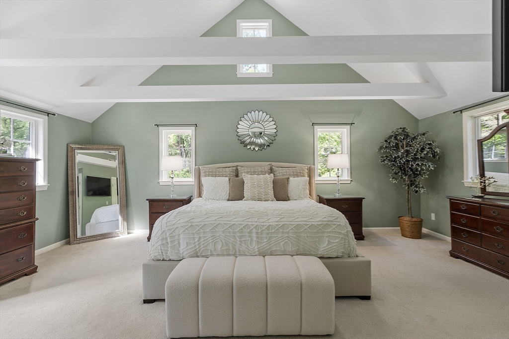 62 Waite Road Boxborough, MA 01719 - Photo 25 of 41 a bedroom with a large bed and a chandelier