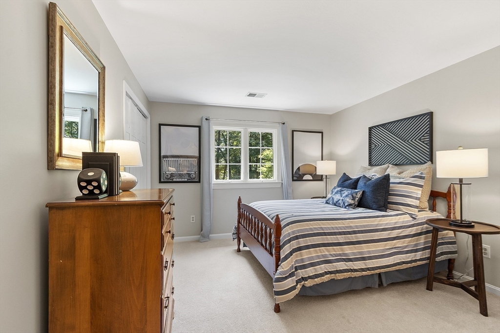 62 Waite Road Boxborough, MA 01719 - Photo 33 of 41 a bedroom with a bed and wooden floor